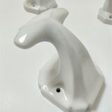 Five art deco white porcelain hooks
