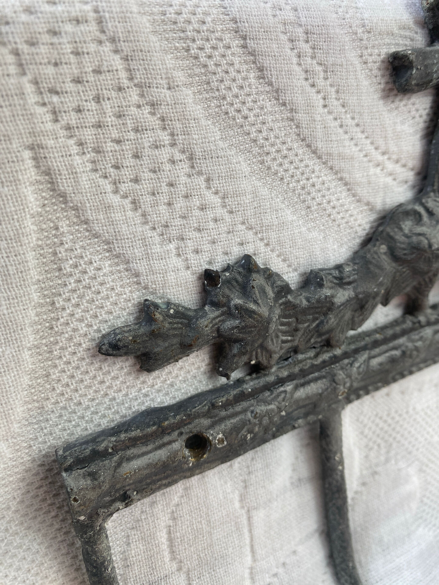 Patinated metal wall bracket and porcelain