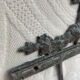 Patinated metal wall bracket and porcelain