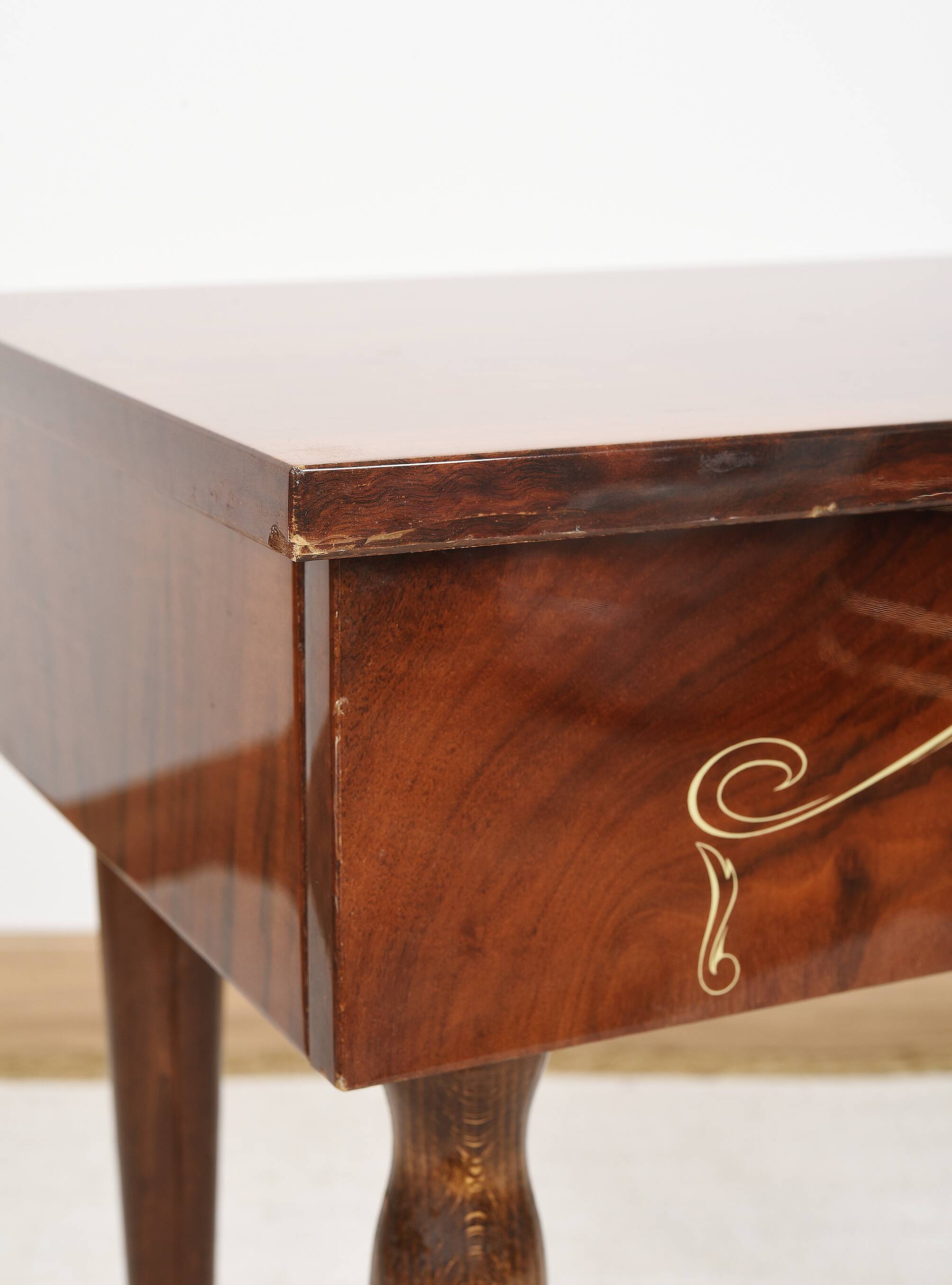 Vintage bedside table from the 70s in varnished wood.