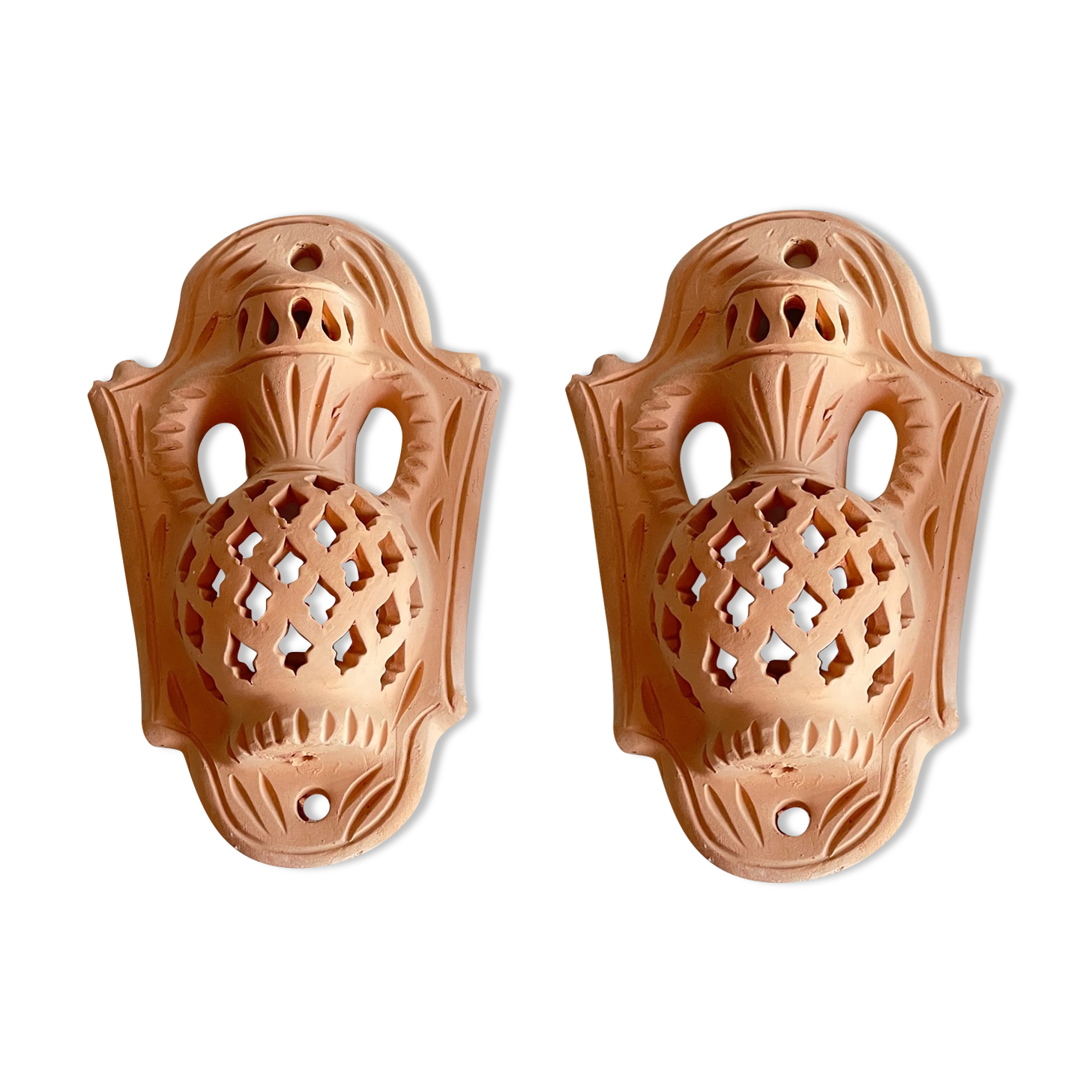 Pair of terracotta wall candle holders