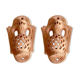 Pair of terracotta wall candle holders