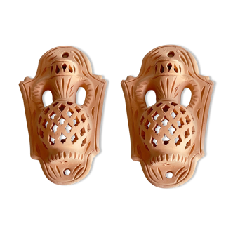 Pair of terracotta wall candle holders