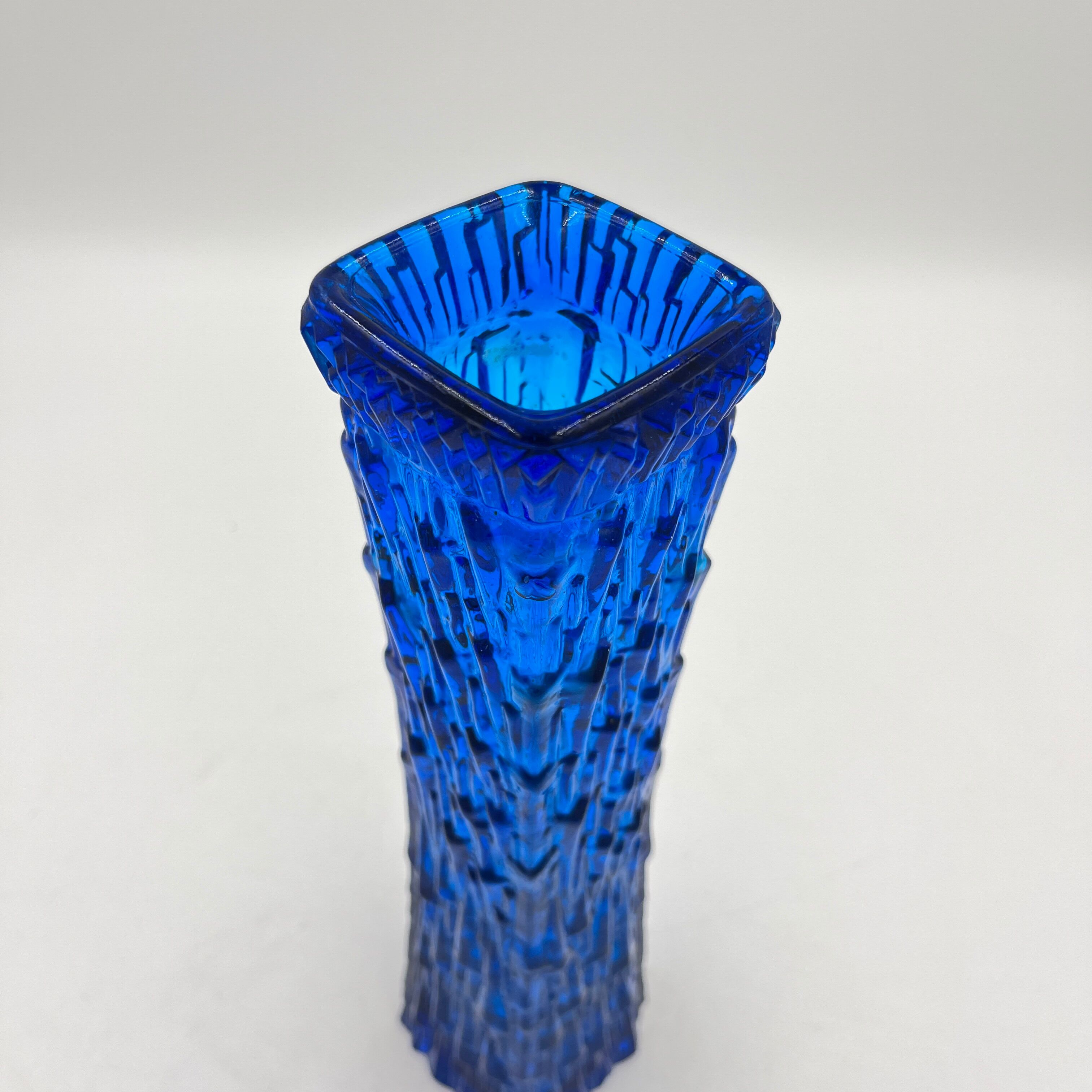 Blue glass vase with relief