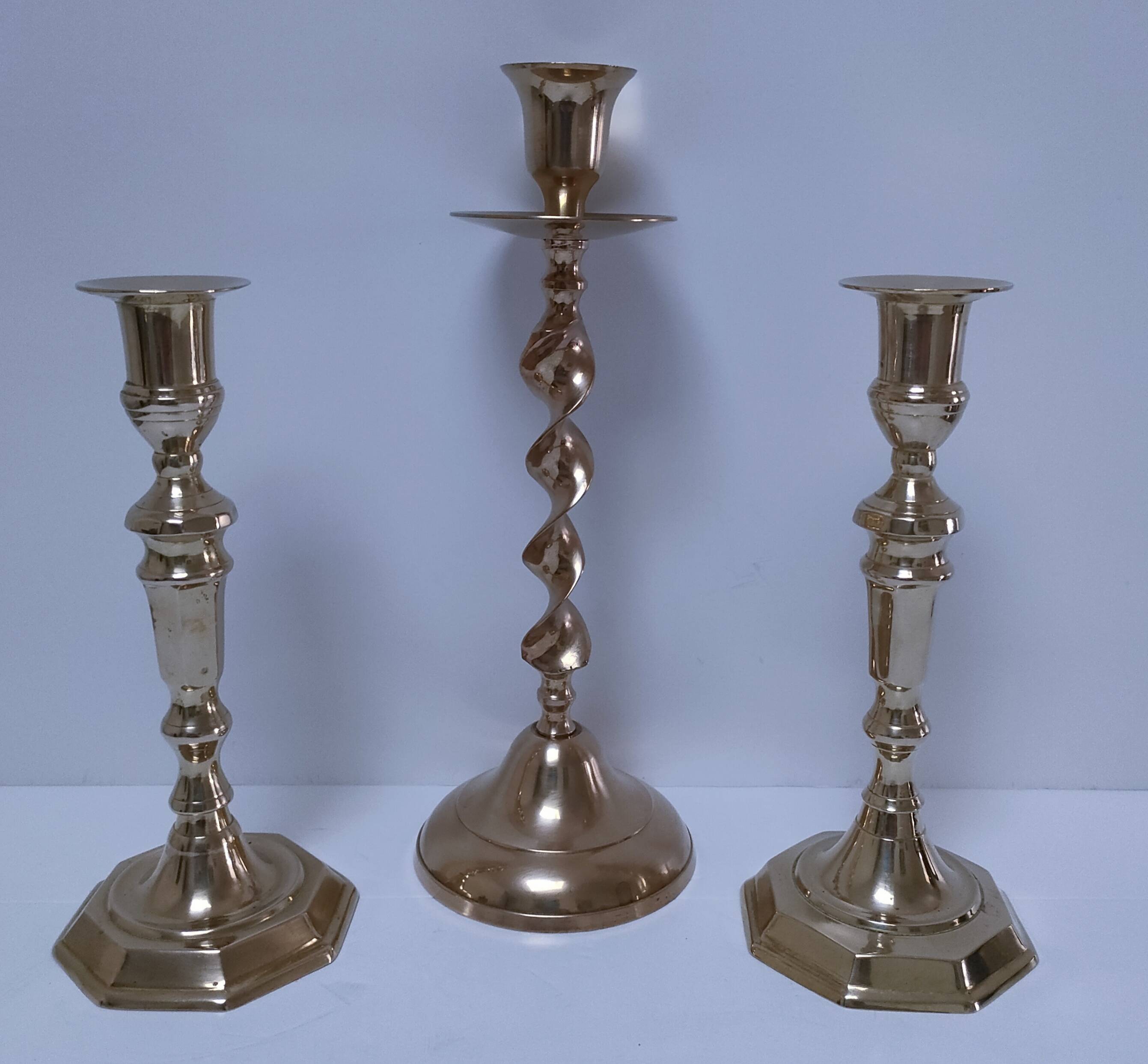 Three vintage solid brass candle holders