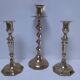 Three vintage solid brass candle holders