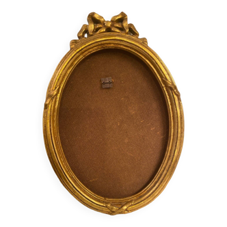 Golden oval wooden frame