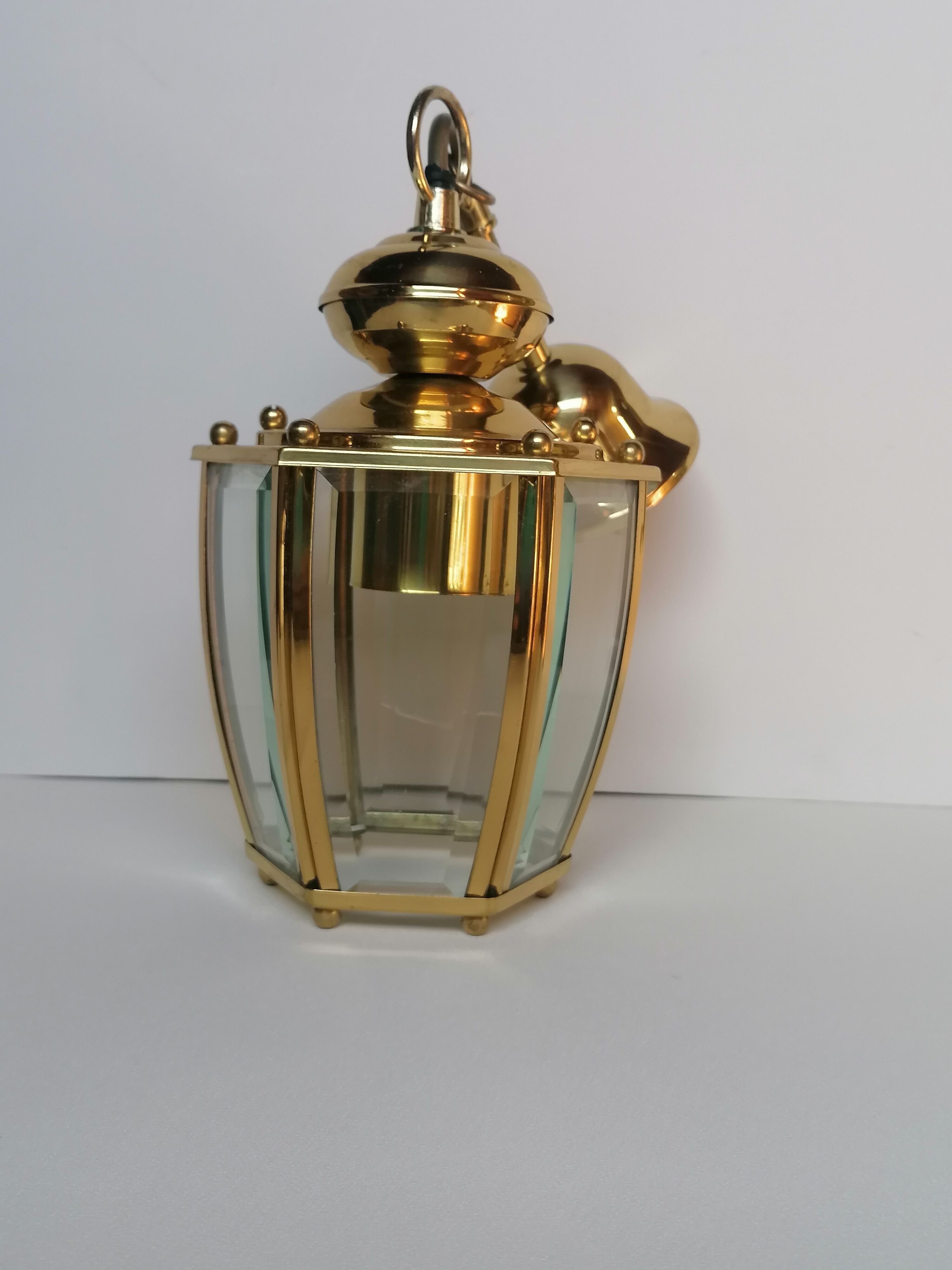 Golden hanging lamp with bevelled glasses