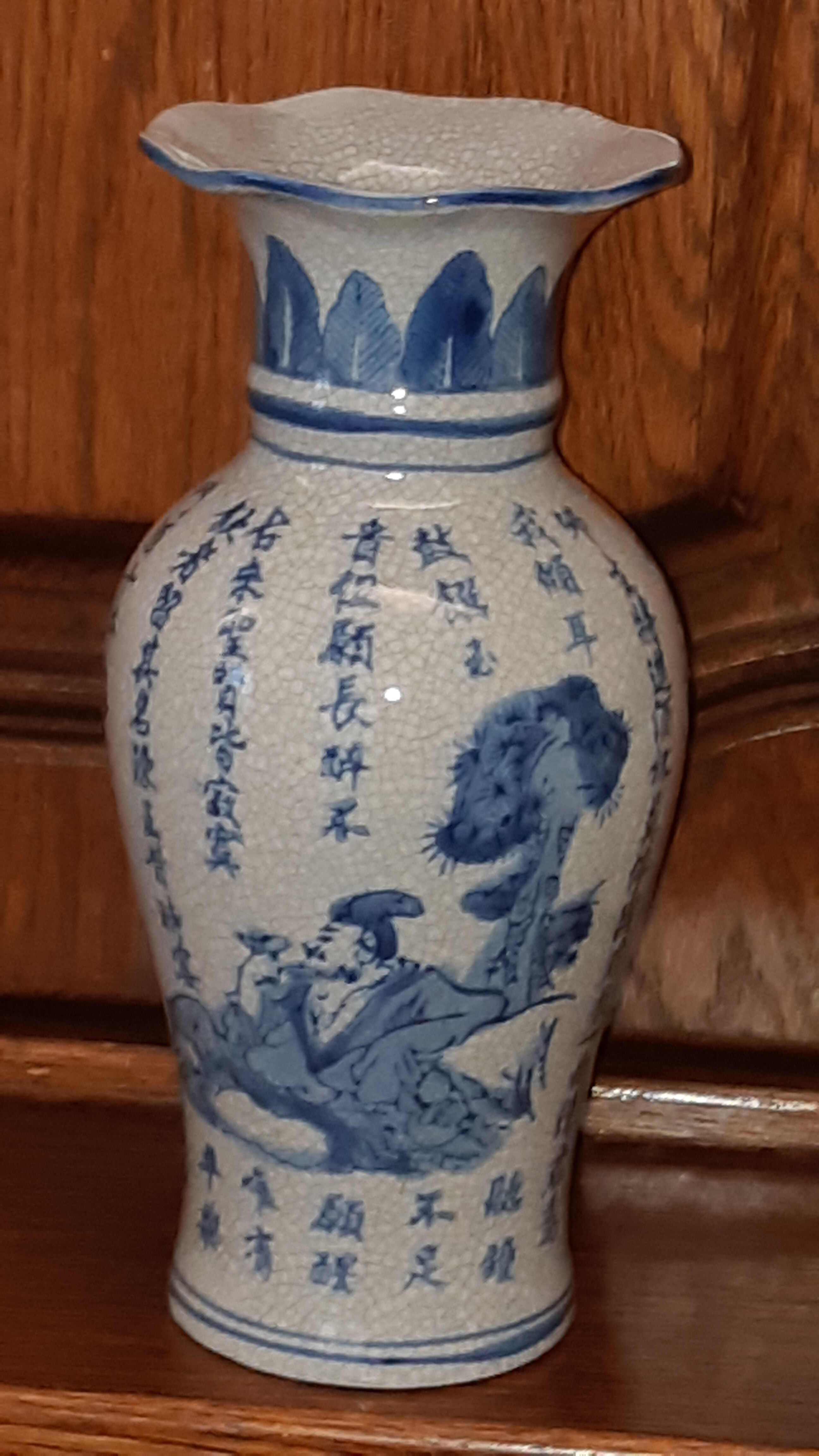 Ancient Chinese vase with blue decoration of sage and inscriptions