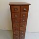 Antique oak apothecary cabinet with drawers