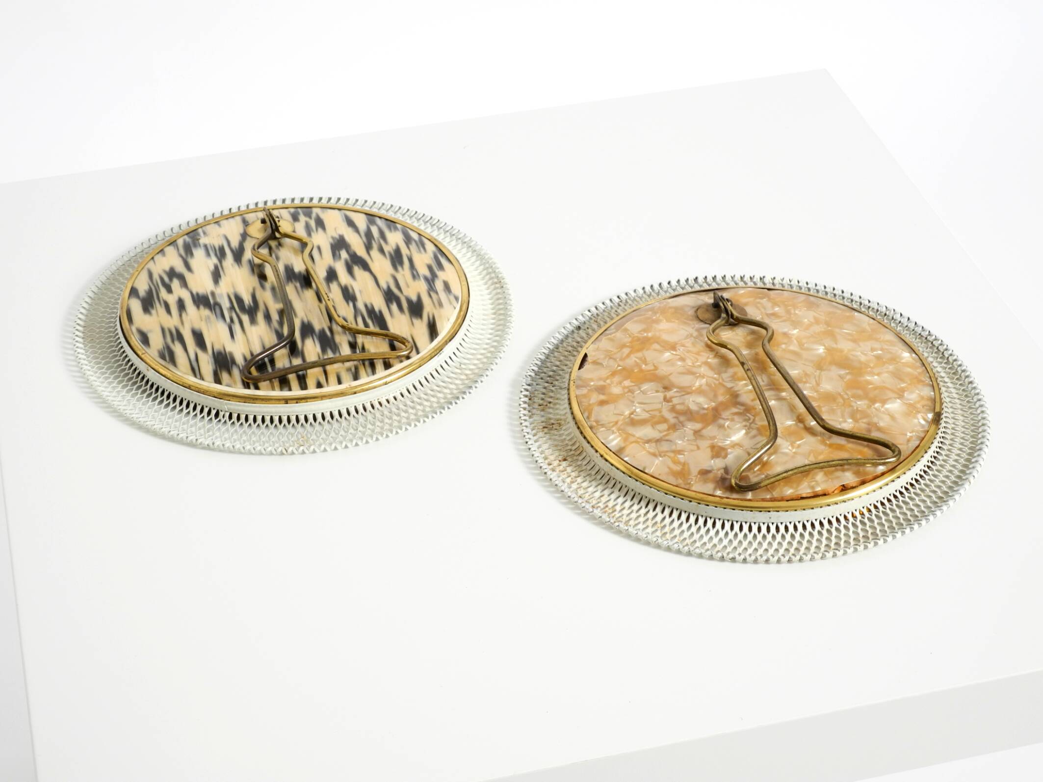 Pair of rare small Mid Century Modern table mirrors with expanded metal fra