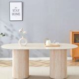 Keysha dining table in travertine with a glossy ceramic top.