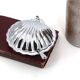 Silver-plated metal and glass shell-shaped butter dish with its knife.