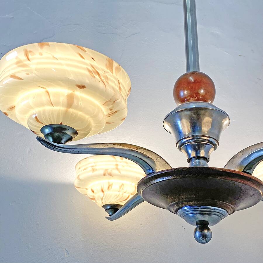 Art Deco chandelier in wood, chrome metal, and glass.