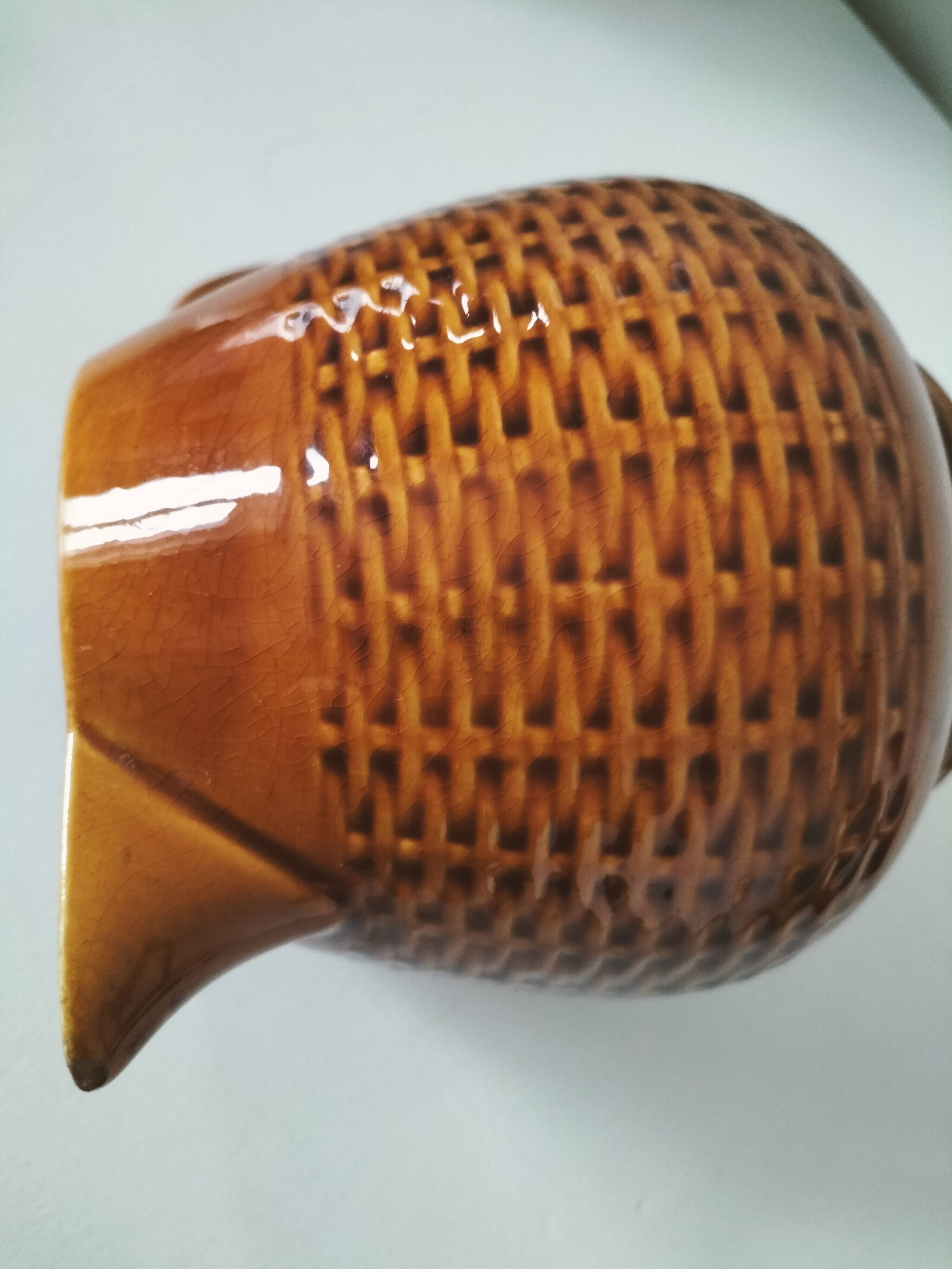 Caramel slipware pitcher with braided relief