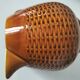 Caramel slipware pitcher with braided relief