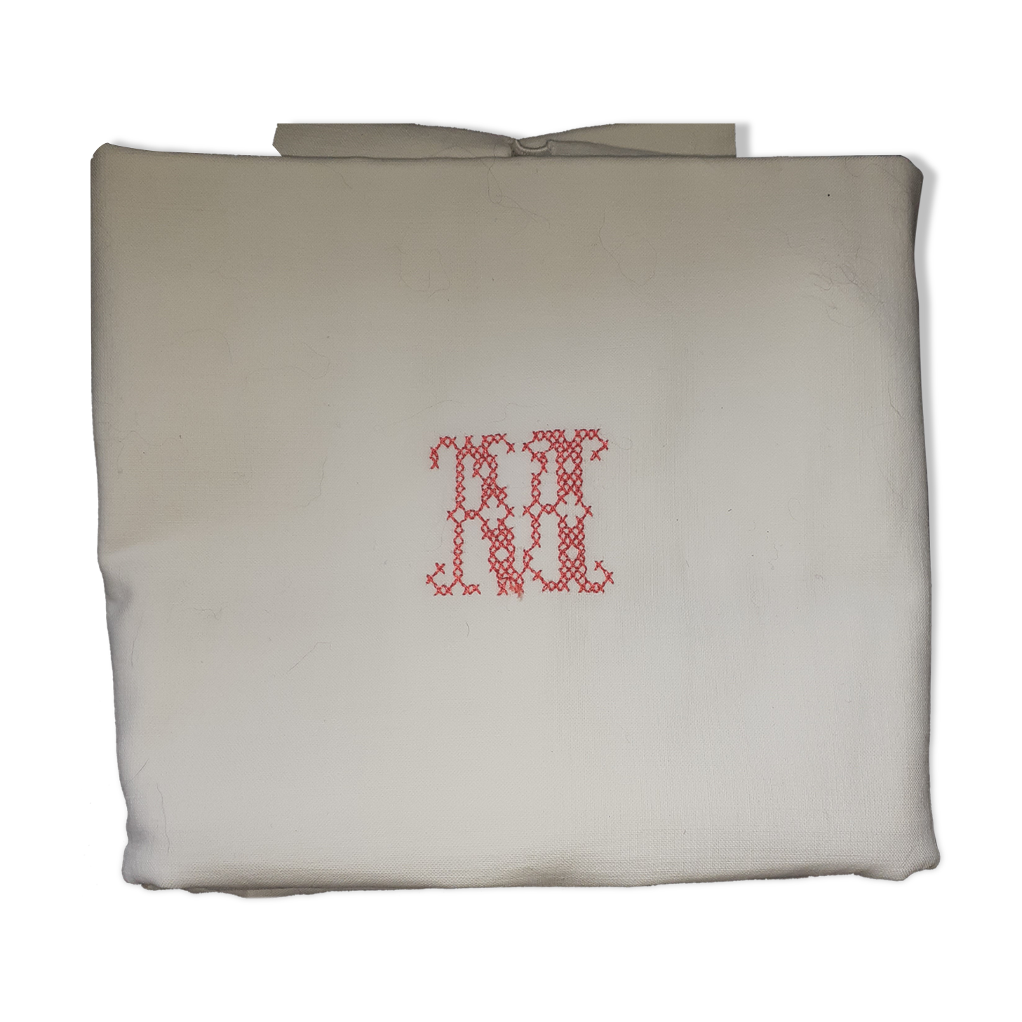 Pillowcase, red central monogram. Surrounded by days.