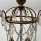 Louis XVI style chandelier with a pearl garland and painted tin, 20th century.