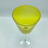 Yellow glass candlestick on a stand