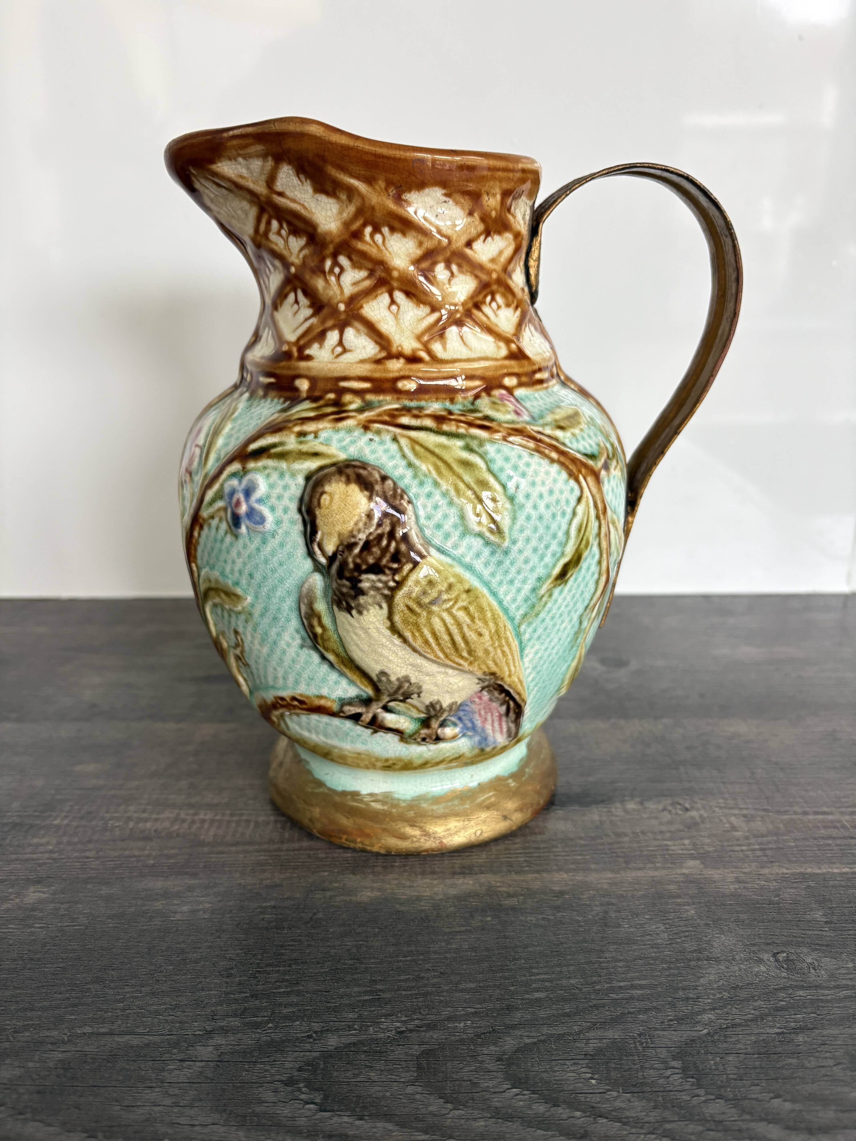 Pichet barbotine 19th century with bird decoration.