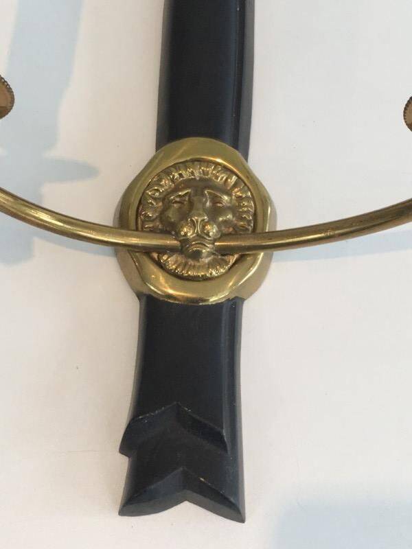 Pair of black lacquered bronze wall sconces decorated with lion heads