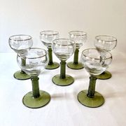 7 Alsace Roemer wine glasses, moss green stepped bases and gold trim.