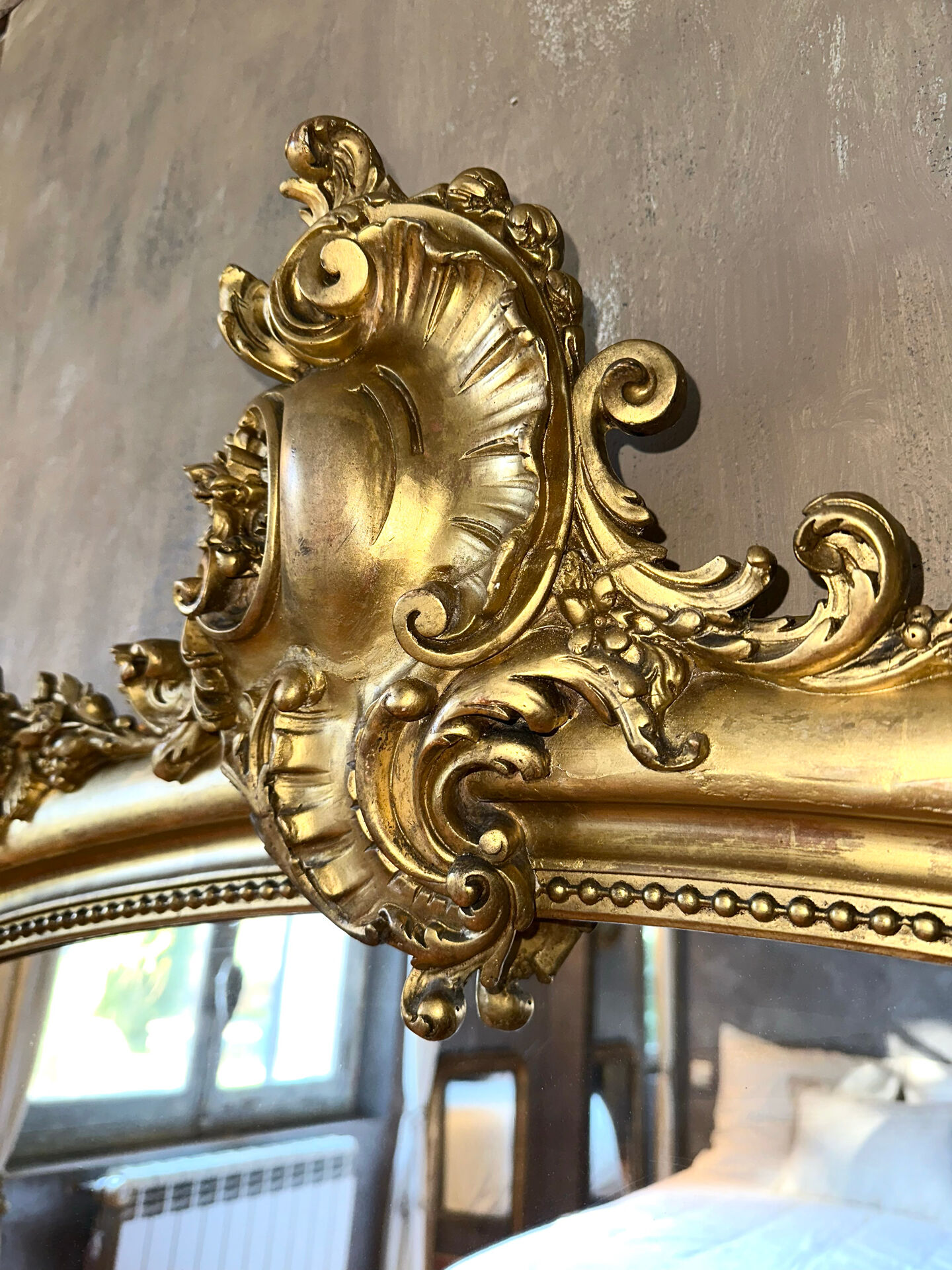 19th-century gilded antique pediment mirror