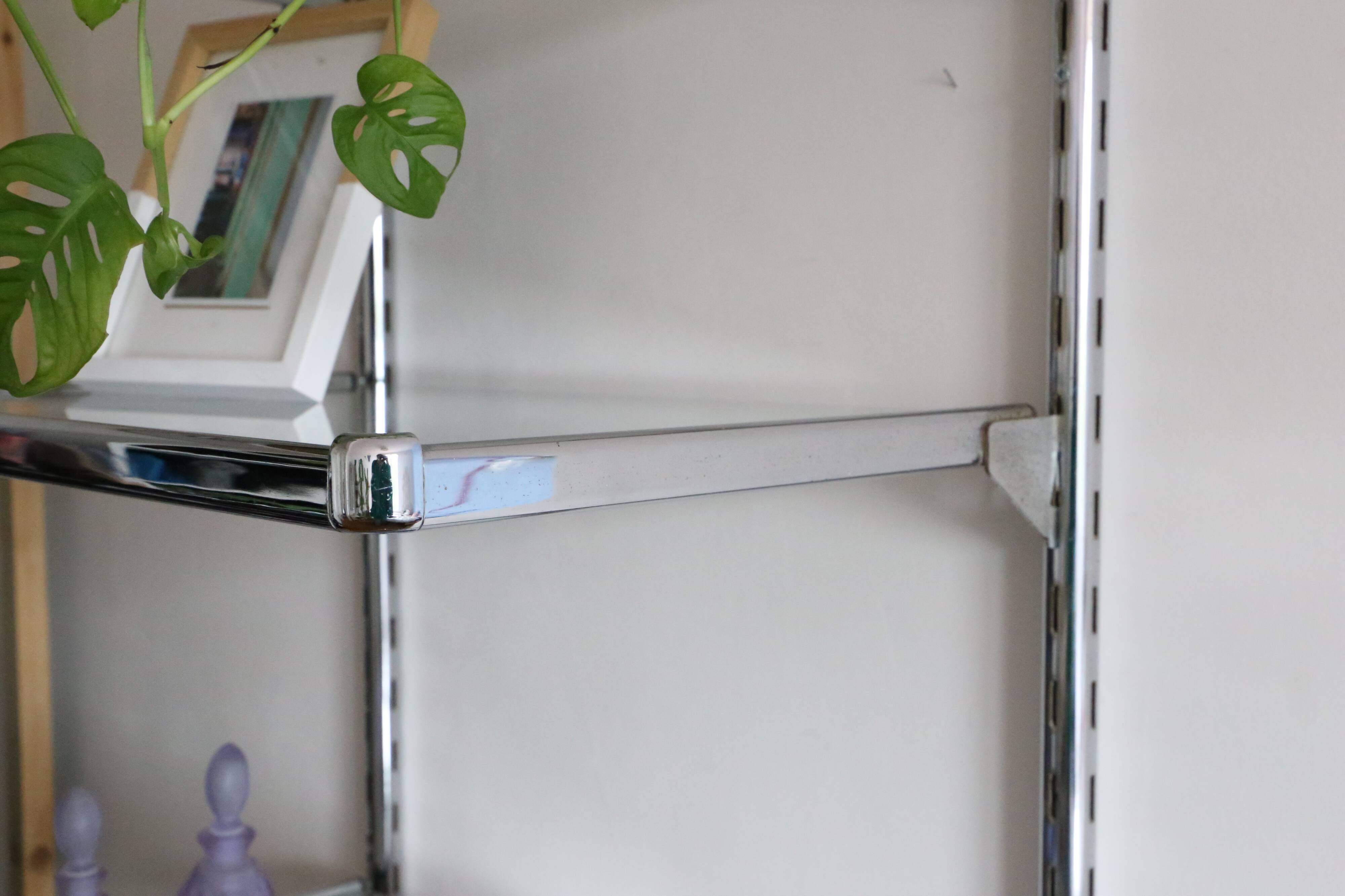Chrome and glass wall shelf, circa 1960
