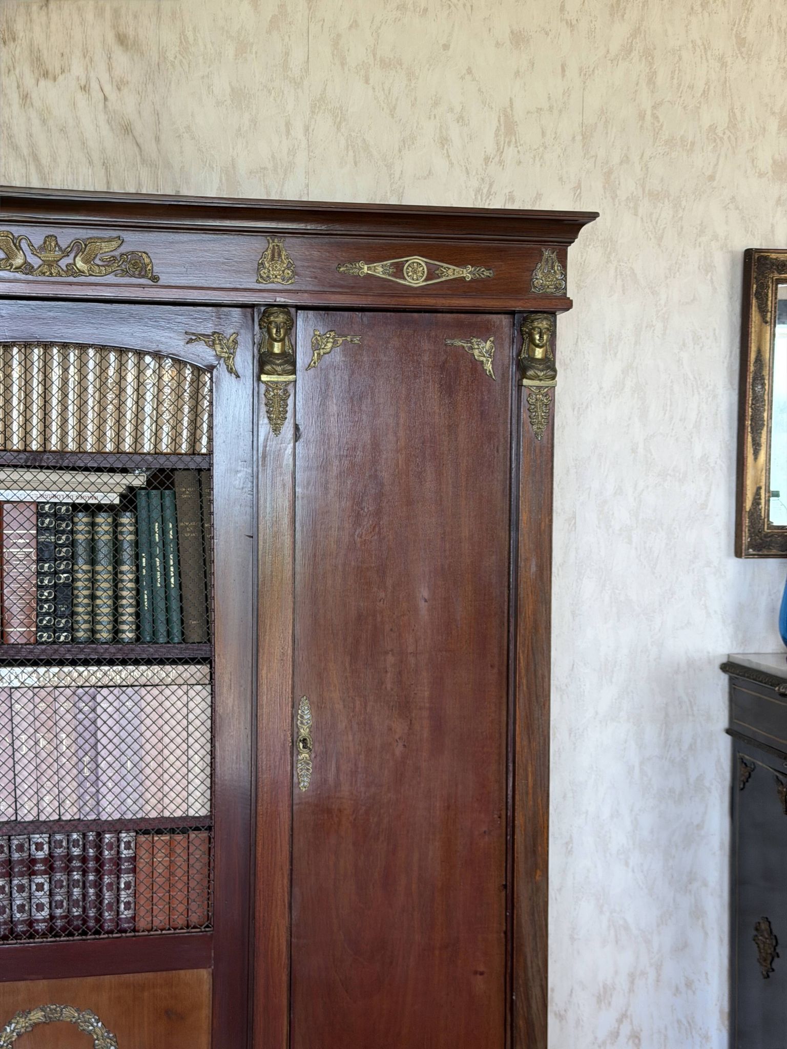 Large antique library from the Empire/Napoleon III period in mahogany and gilded bronze.