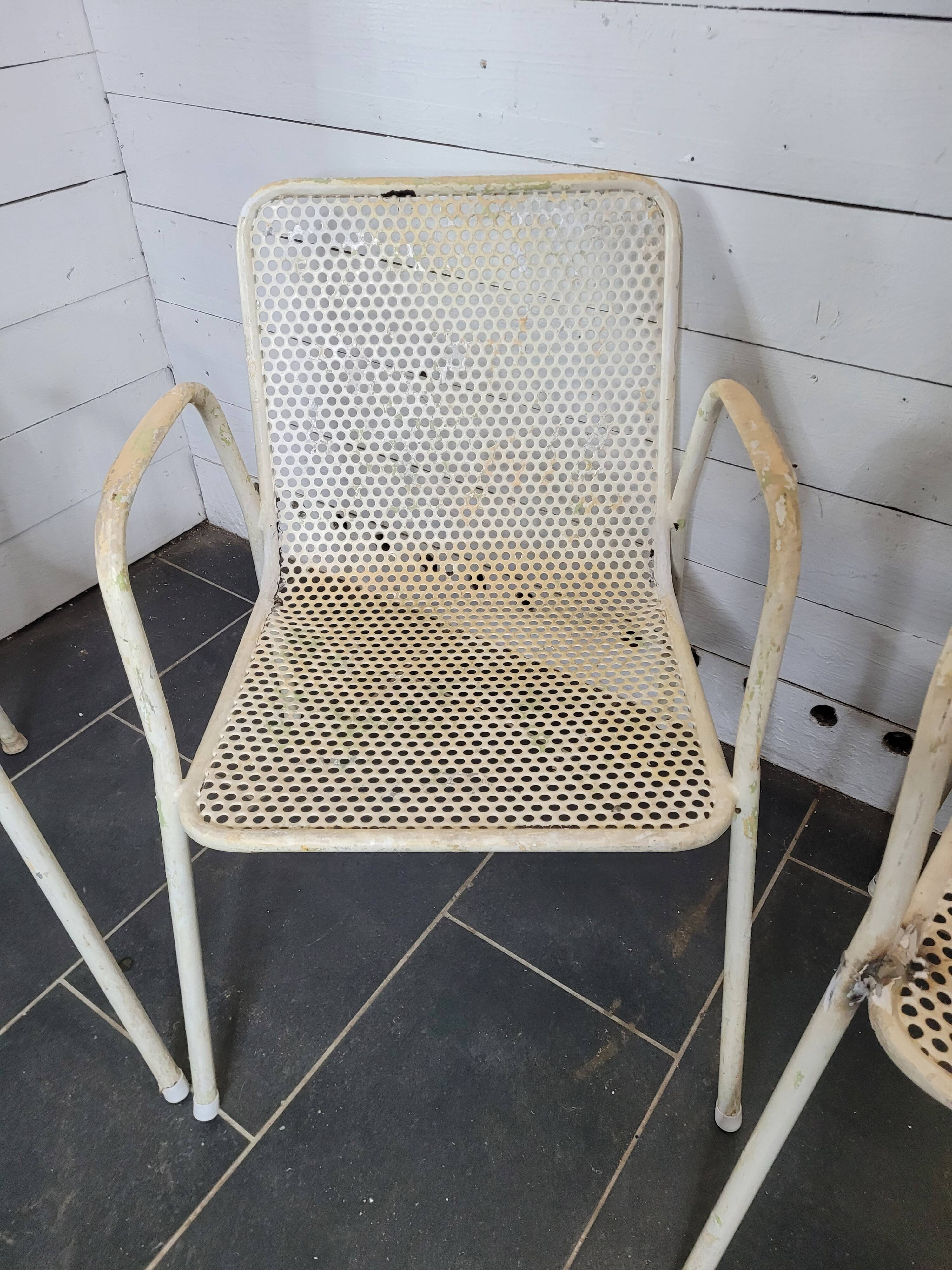 4 perforated metal garden armchairs