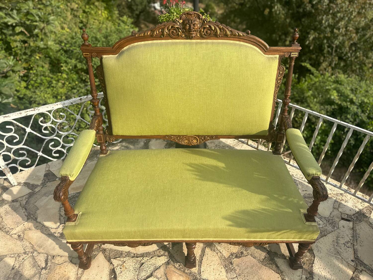 Richly carved solid wood bench in Louis XVI style.