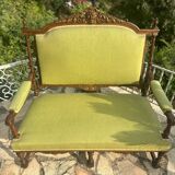 Richly carved solid wood bench in Louis XVI style.