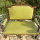 Richly carved solid wood bench in Louis XVI style.