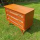 Rattan and wood splayed-leg chest of drawers