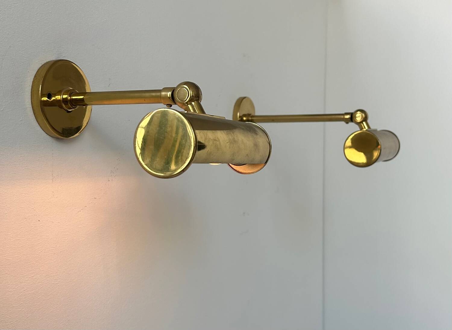 Pair of vintage adjustable wall lights, solid brass, France 1950
