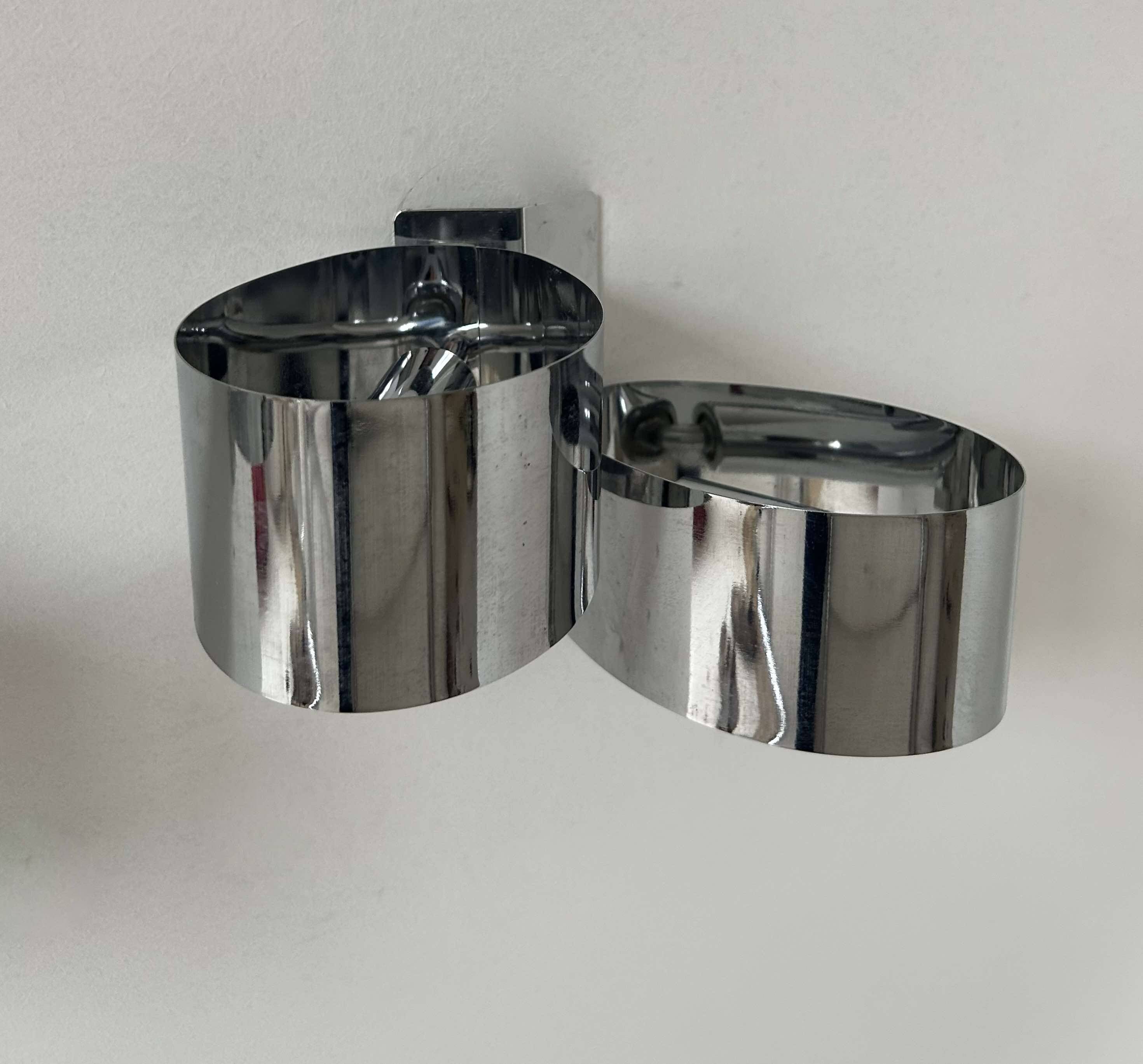 Pair of vintage wall lights, curved chrome metal, France 1970