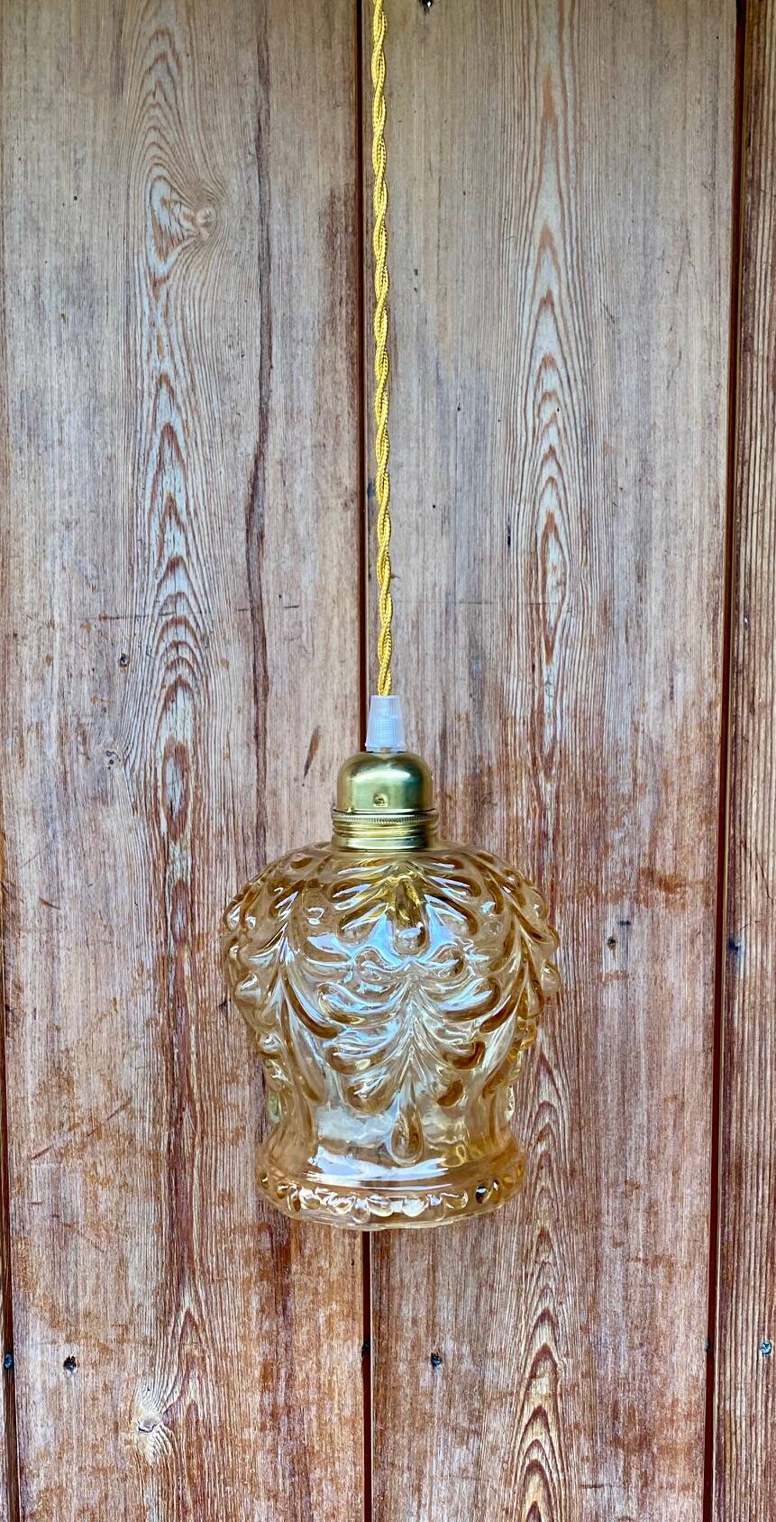 Vintage cut amber glass suspension globe.