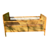 Vintage wooden and rattan baby cot from the 1960s.