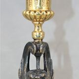 Pair of candle holders in gilded bronze and patinated with a candle