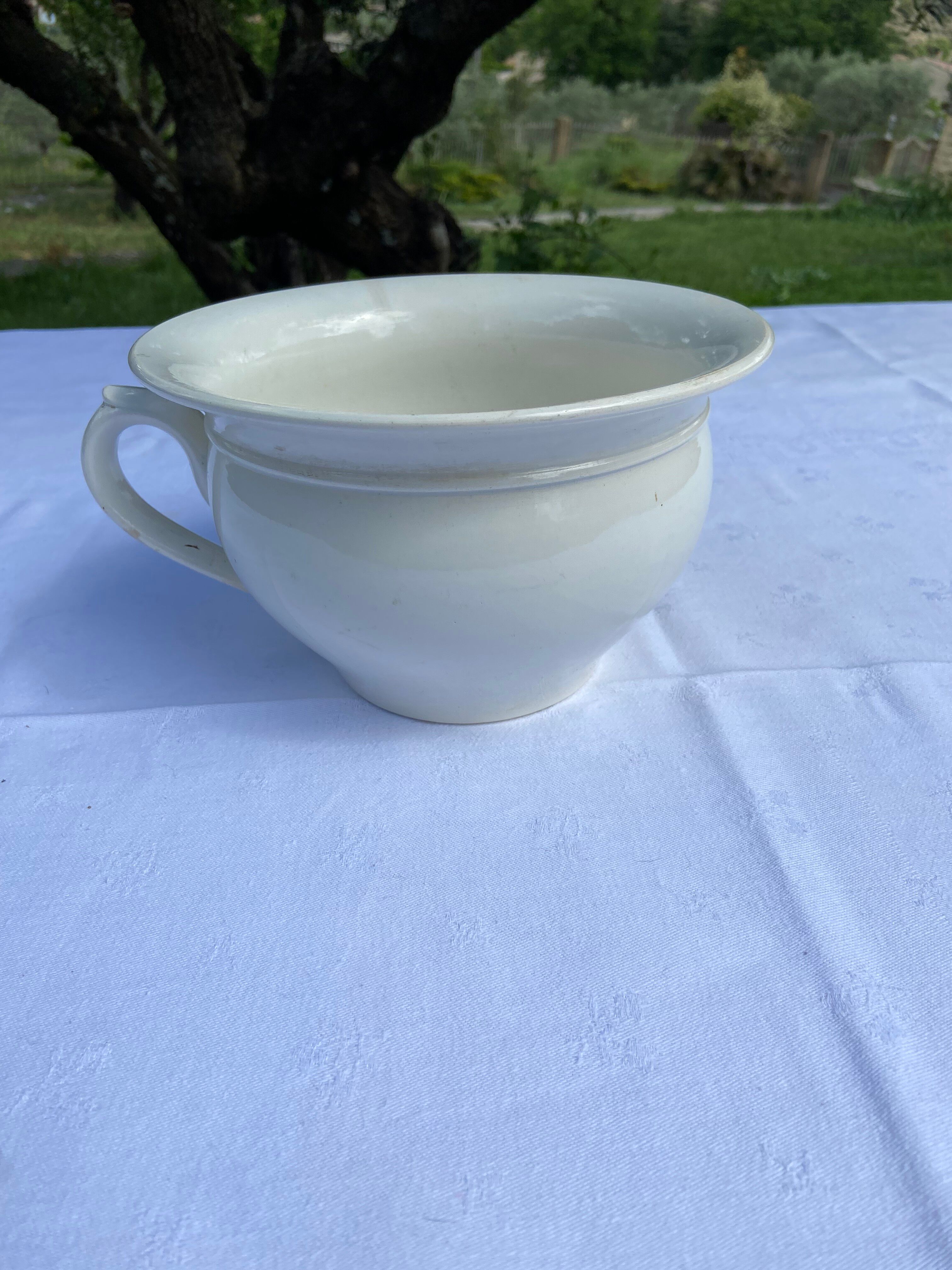 Old Digoin chamber pot in white earthenware – repurposed as a dice bowl.