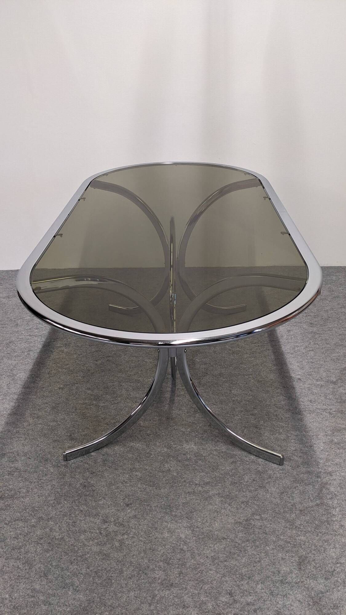 Oval dining table in chromed metal and smoked glass, Italy circa 1970