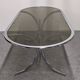 Oval dining table in chromed metal and smoked glass, Italy circa 1970