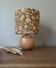 Table lamp with a wooden ball base, floral print in bohemian style.