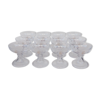 12 Val Saint Lambert crystal champagne glasses. Plain Bell Foot Service. Late 19th century.