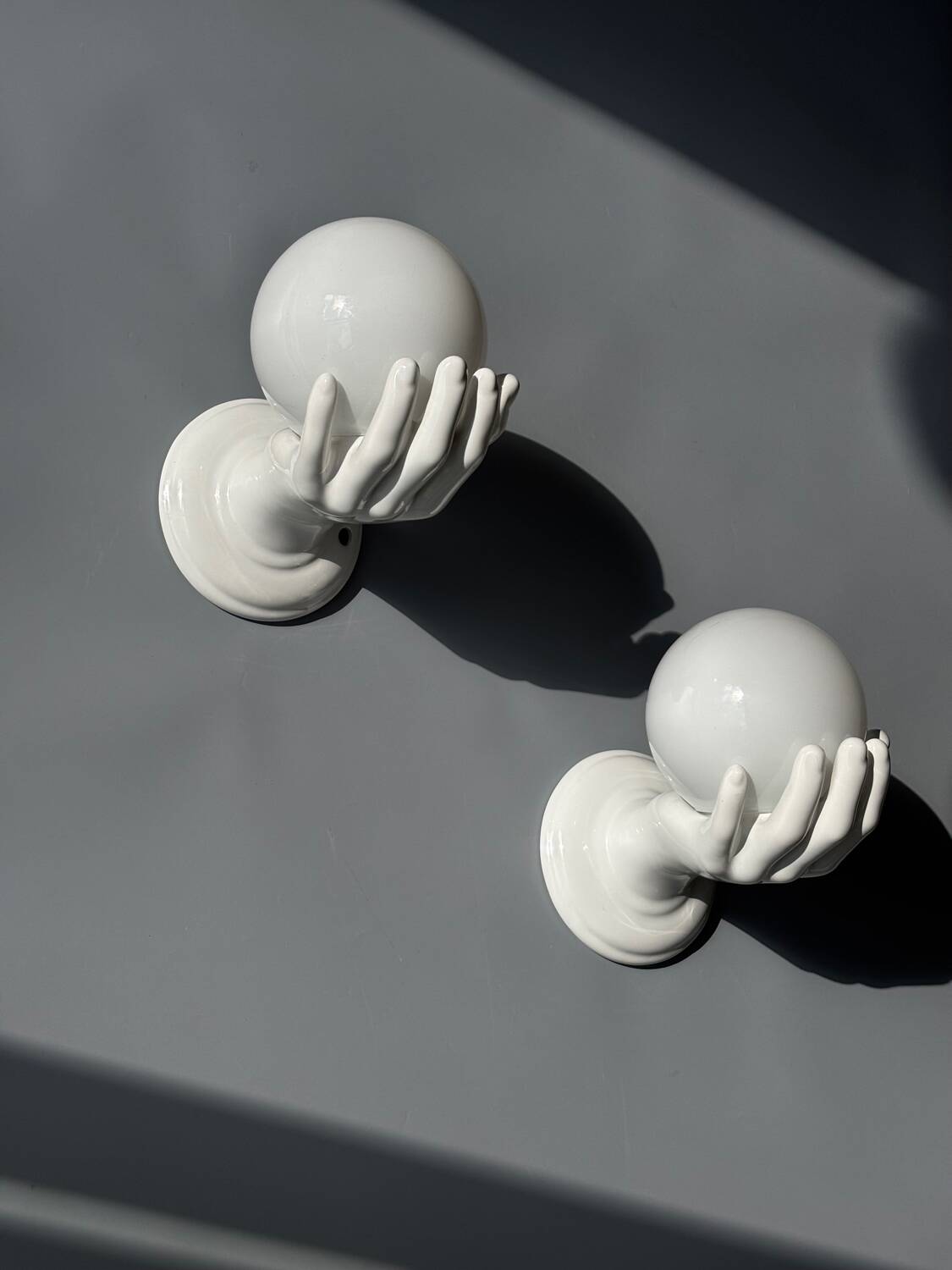 Pair of opaline and ceramic hand sconces
