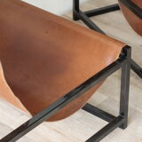 Pair of vintage armchairs in stretched leather and metal structure
