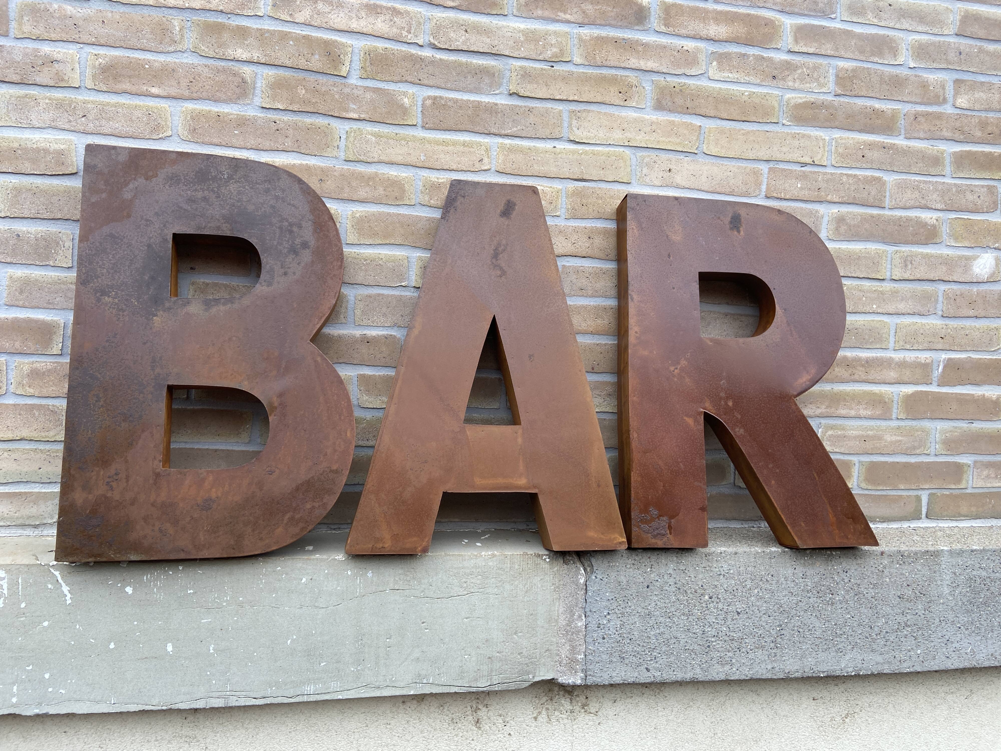 Bar sign in vintage metal letters