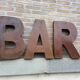 Bar sign in vintage metal letters