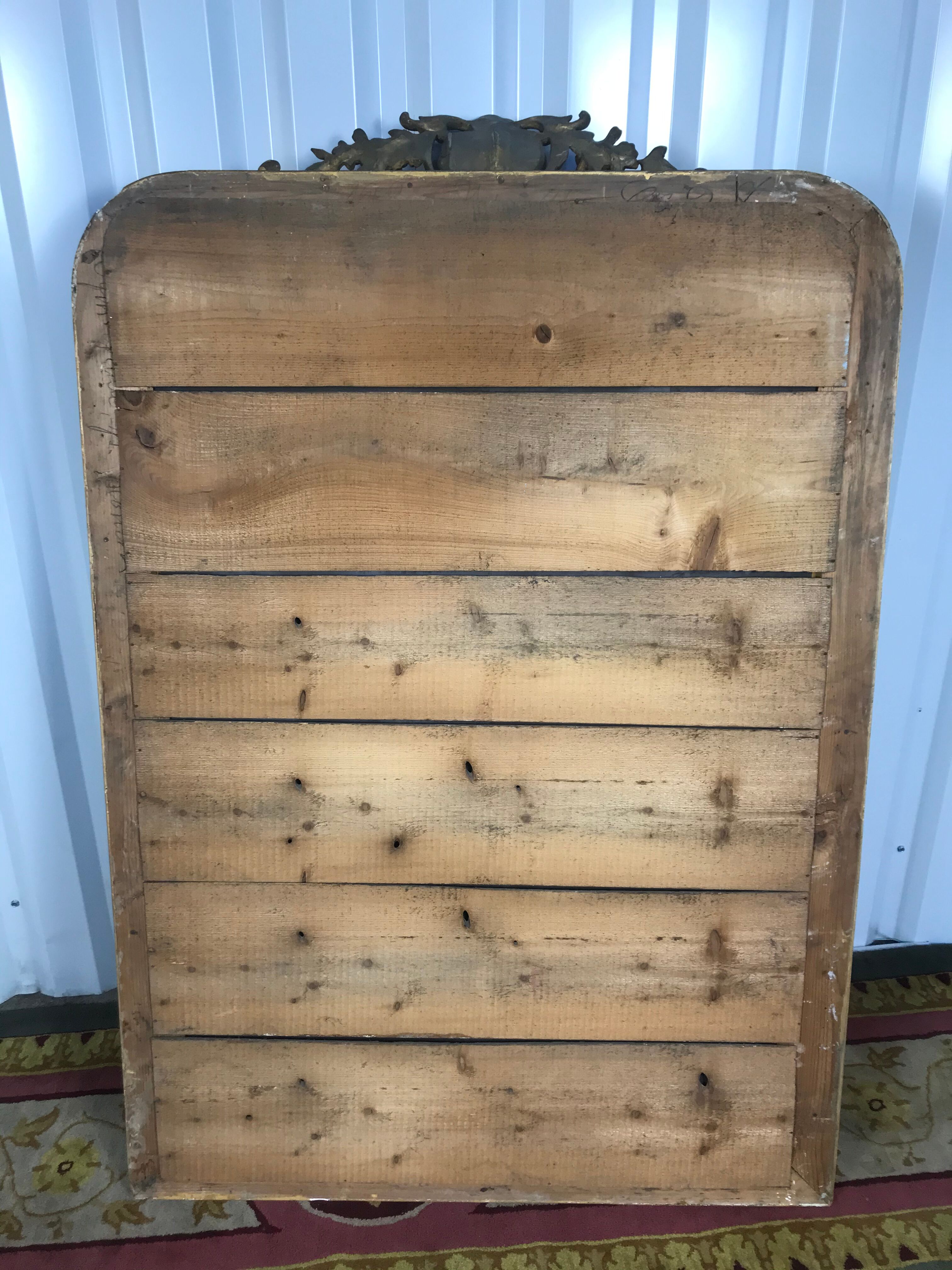 Louis Philippe's era mirror with a gold leaf pediment