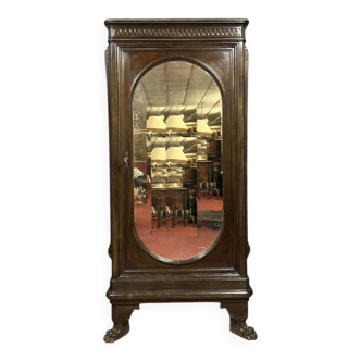 Renaissance style oval mirror cabinet in solid walnut circa 1850